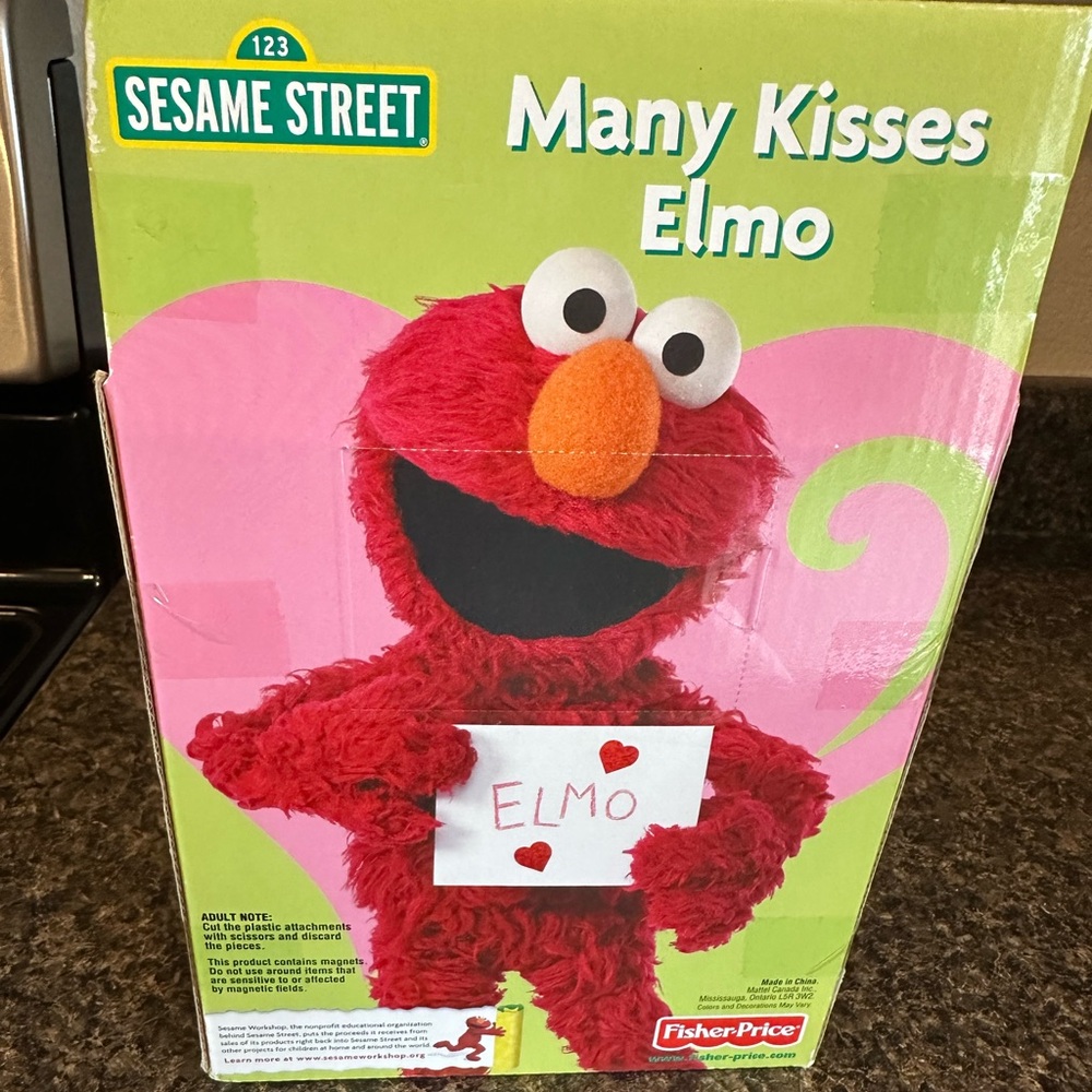 Many Kisses Elmo-NEW, in box with original tags and original packaging.
